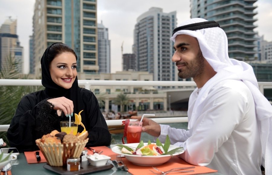 Emirati couple dining in Dubai Marina